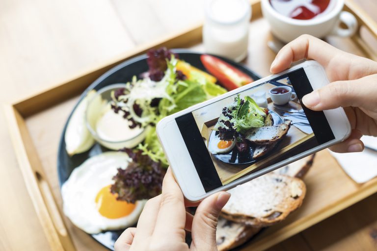taking a photo of meal on smartphone