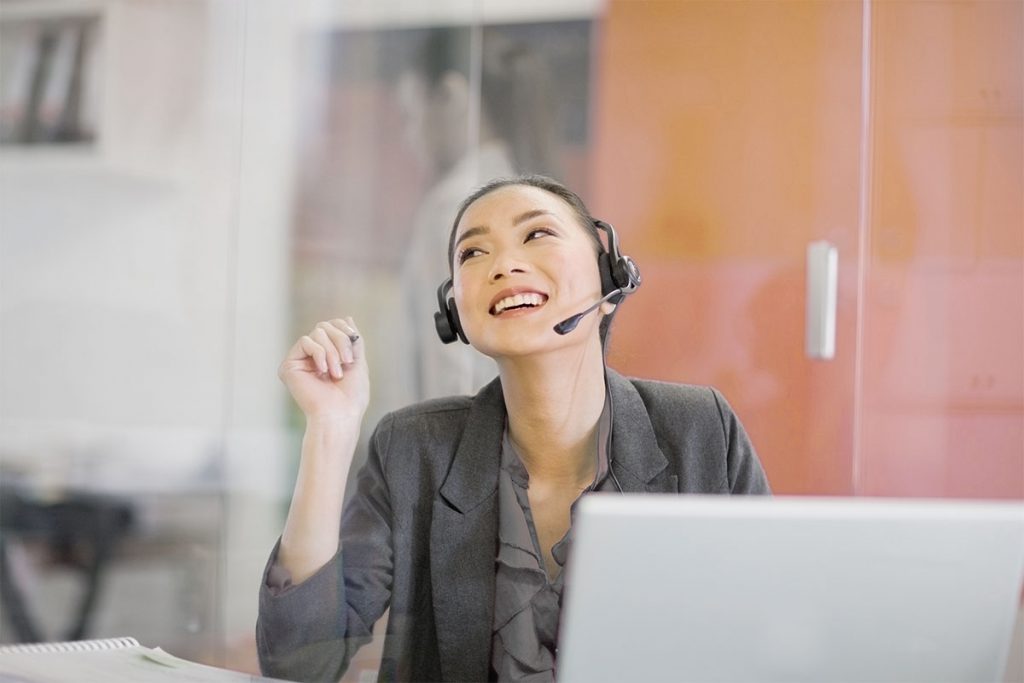 smiling call center agent with headset