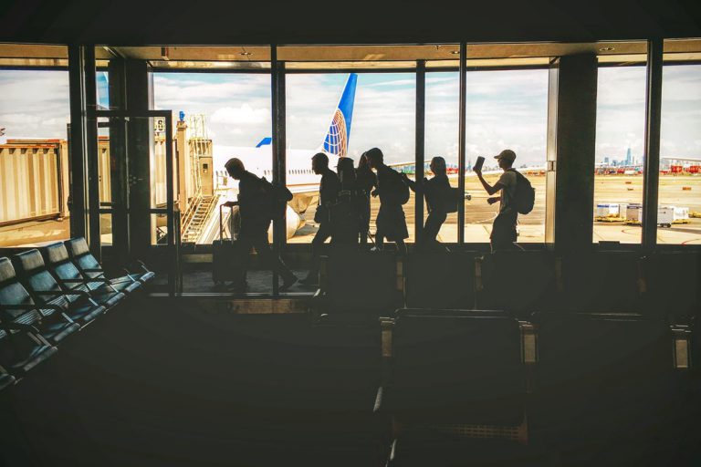 silhouettes against a window airport guest service experience